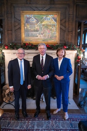 Governor and First Lady DeWine posing with George Will. 