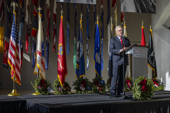 Wide angle photo of Ohio Lt. Governor Jim Tressel speaking at podium during Wreaths Across America’s annual wreath-laying ceremony in Columbus.