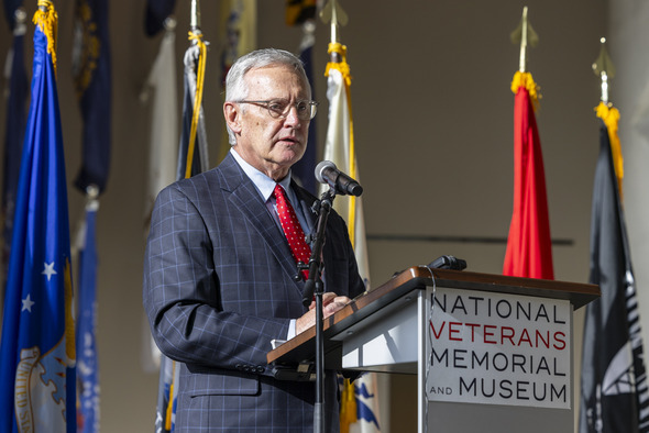 Medium angle photo of Ohio Lt. Governor Jim Tressel speaking at podium during Wreaths Across America’s annual wreath-laying ceremony in Columbus.