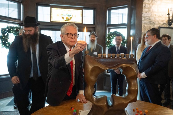 Governor DeWine lighting the menorah and celebrating Hanukkah.
