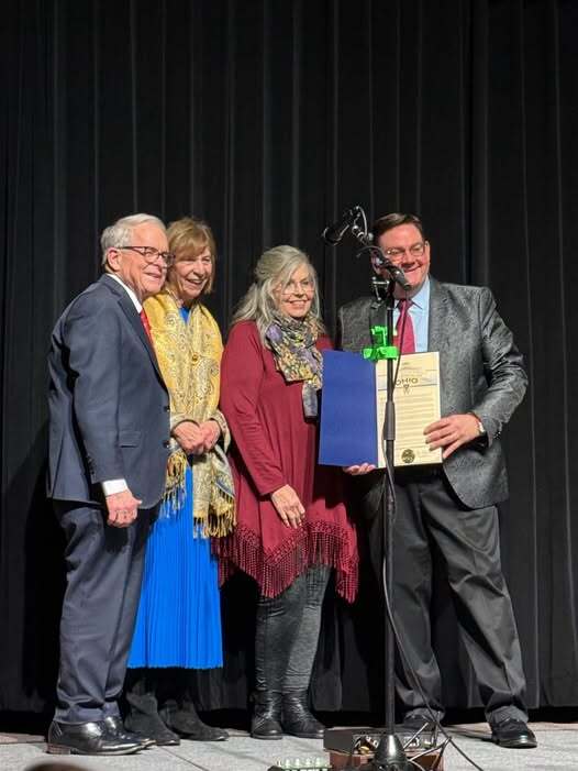 Ohio Governor Mike DeWine, First Lady Fran DeWine , and Joe Mullins and the Radio Ramblers posing together.