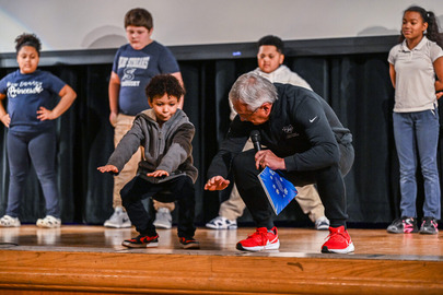 Lt. Governor Tressel doing a squat with a student from Sandusky Schools. 