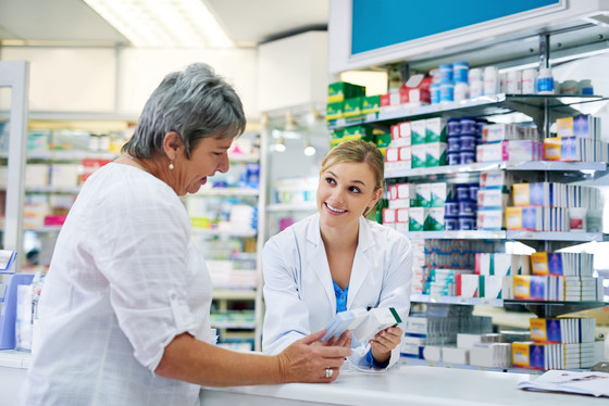 Pharmacist Helping Woman