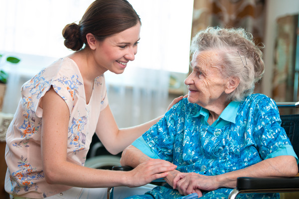 home health nurse and patient chatting