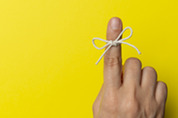 String around finger as a reminder tip