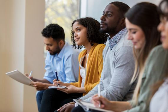 Group of people listening during a group training session