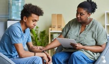 Image of counselor and young man