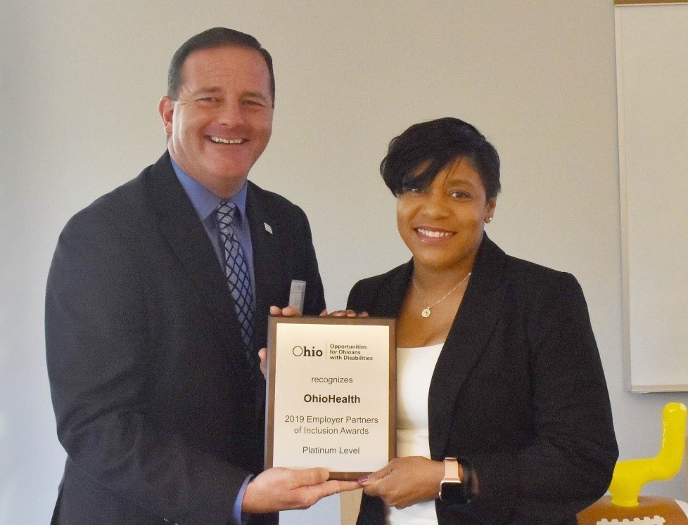 OOD Director Kevin Miller (left) presents award to Lynnise Smith, Supplier Diversity Manager, OhioHealth