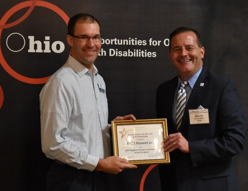  OOD Director Kevin Miller present EPI Award to Brian Brough of HCR ManorCare