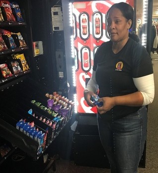 Nicole Perrin, Business Enterprise operator, fills her vending machines at the Wright-Patterson Air Force Base.