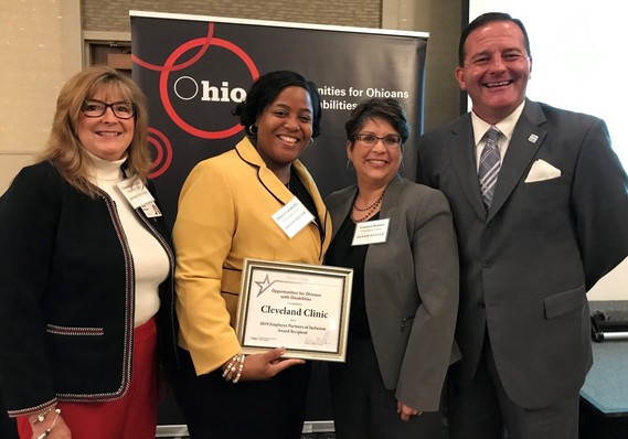 Photo of Connie Kleckner, Dawn Caraballo and Carmen Roman of The Cleveland Clinic accepting EPI Award from Director Miller