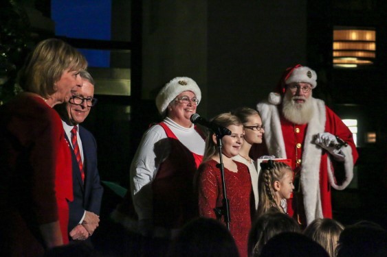 First Lady Fran DeWine, Governor DeWine, Children Signing, and Santa Claus