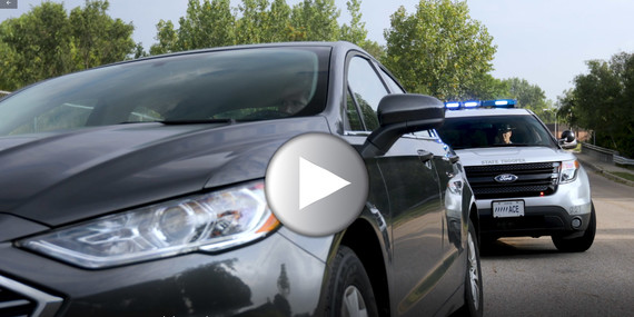 car pulled over for a traffic stop with a law enforcement official