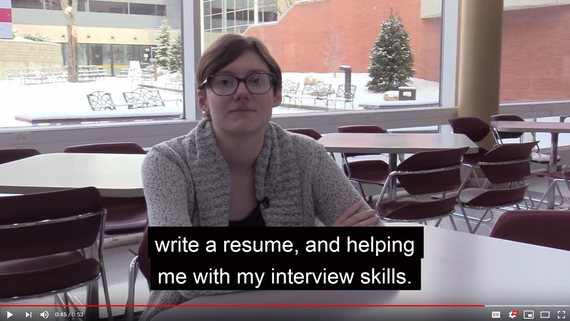 young woman sitting at table 