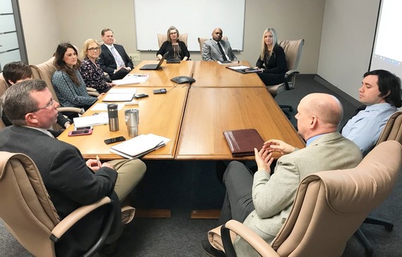 Staff with OOD Employer and Innovation Services Seated Around a Conference Table