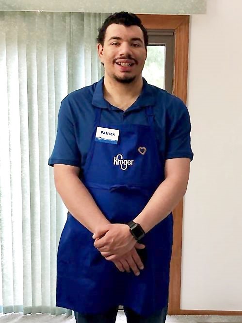 Photo of a young man in Kroger apron