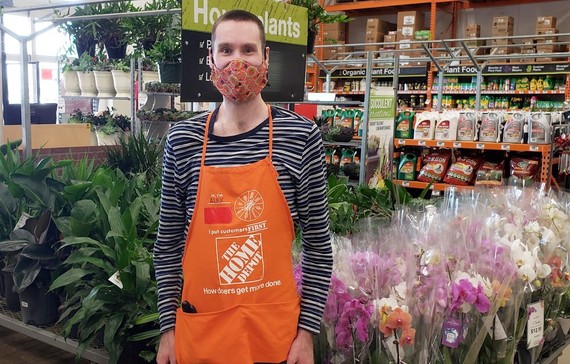Photo of Alex Claus with mask in at his job Home Depot Garden department