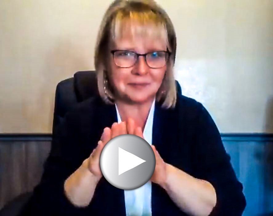  still of Shannon Seger taken from video as she signs invitation fro deaf community to take part in survey