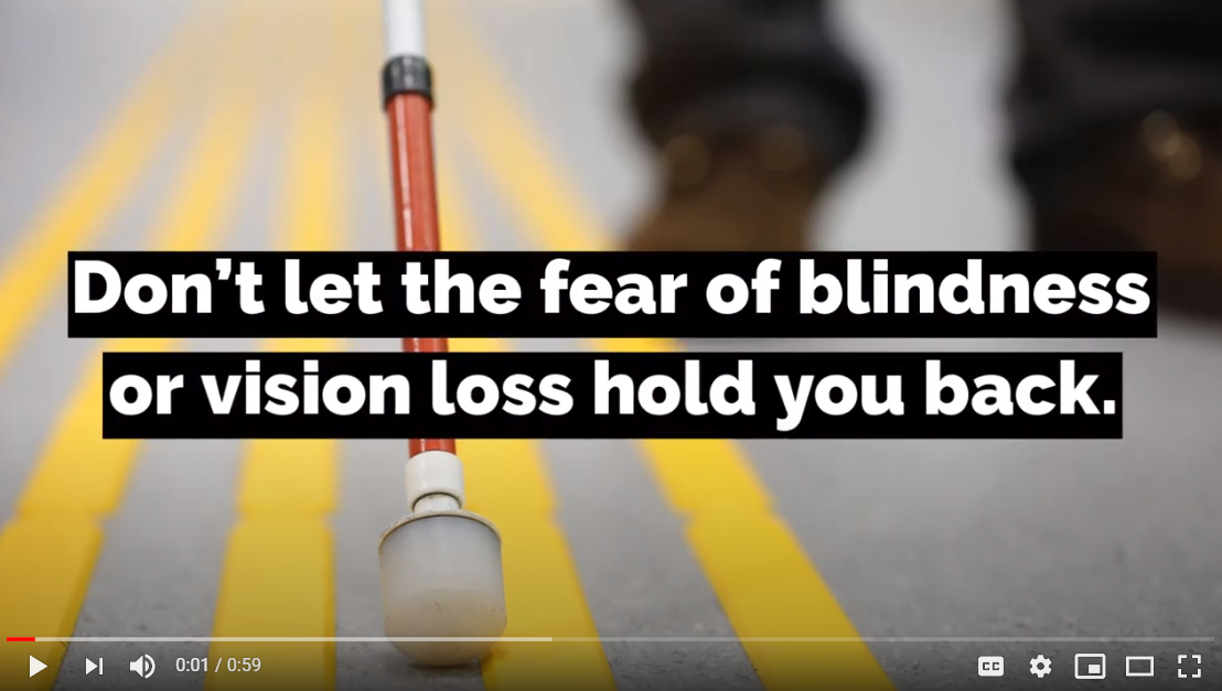 photo of a blind person's feet and cane on a crosswalk