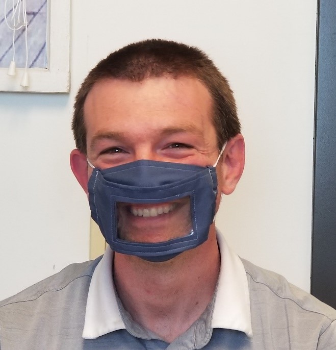 Photo of Jason Yoder with a clear face mask