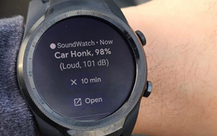 Photo of watch face on someone's wrist: Text  on watch: Soundwatch- Now: Car Honk, 98% (loud, 101db) X10 Open