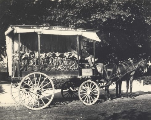 Jesup Agricultural Wagon: horse pulling wagon with George Washington Carver seated