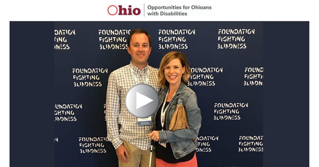 Man and woman standing in front of image Foundation Fighting Blindness