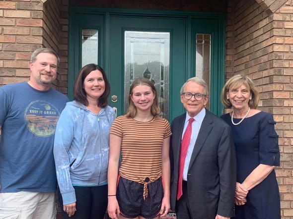 Week 5 Vax-A-Million Winner Sydney standing with her parents, Governor Mike DeWine, and First Lady Fran DeWine.