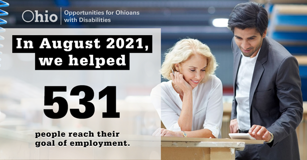 Photographic with man and woman looking at a calculator. Text: In August, 2021 we helped 531 people reach their goal of employment