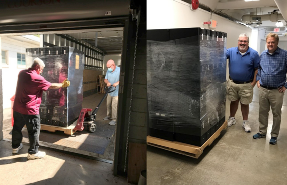 Photos of computers being off-loaded off a truck and  photo of computers on pallets delivered to Dr. Darling and Eric at AT