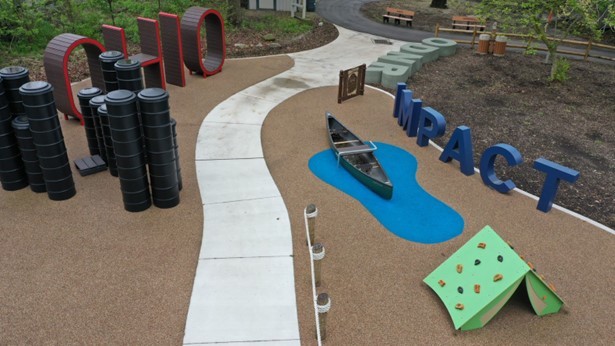  Photo of new accessible playground at Ohio State Fair featuring a large canoe and a book.