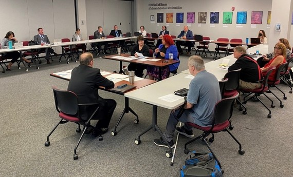 Photo of people meeting around a table