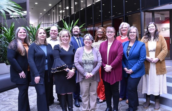 Photo of 11 OOD staff standing and smiling