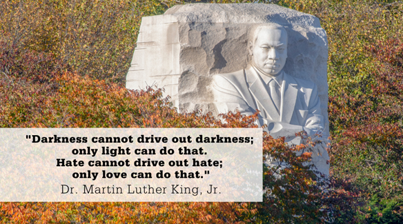 Graphic of Dr. Martin Luther King, Jr. on a stone. Text, Darkness Cannot dirve out darkness only light can do that.