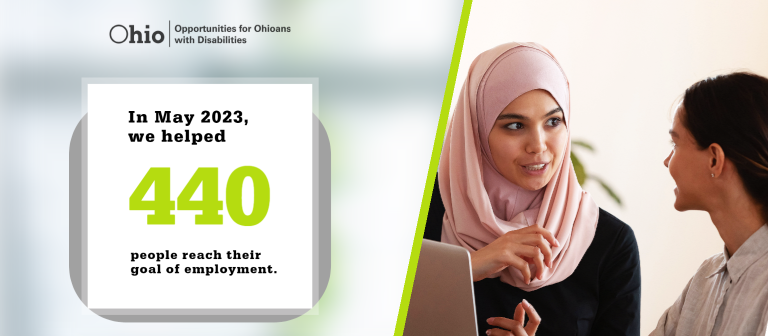 Two women are talking while working on a laptop. "In May 2023, we helped 440 people reach their goal of employment." OOD logo. 