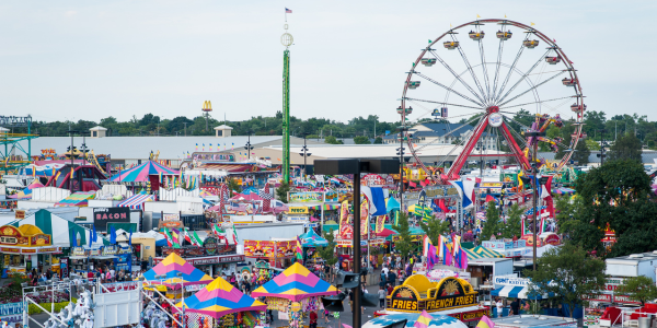 Ohio State Fairgrounds with rides, tents, and food vendors
