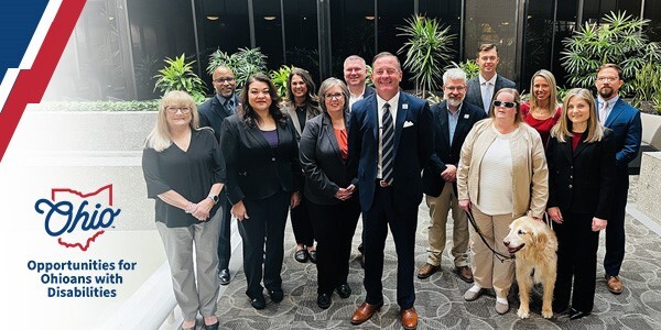 2024 Executive Team and Director Miller in the lobby of the Central Office.