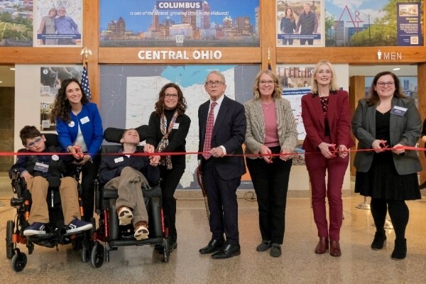 Governor DeWine and group pose for photo at universal changing table event.