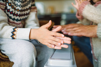 Family hands on radiator