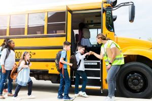 students boarding school bus