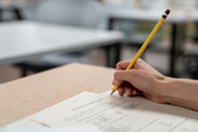 Close up of hand holding a pencil