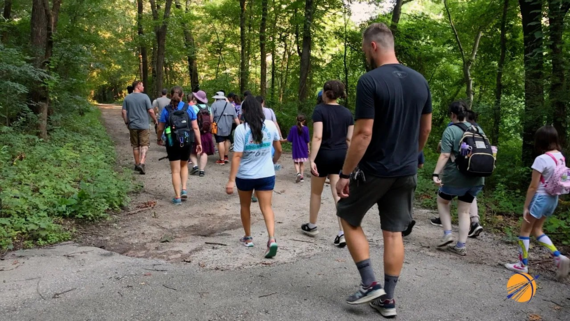 Individuals hiking through Ray Harral trails