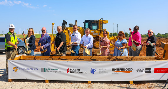 The City Council and City Manager Michael Spurgeon and the developers from Hackberry Market shovel dirt at a groundbreaking ceremony.