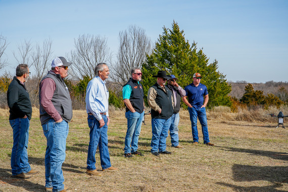 A group of legislators and conservation professionals watching a presentation.