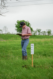 Boy evaluating site for range purposes