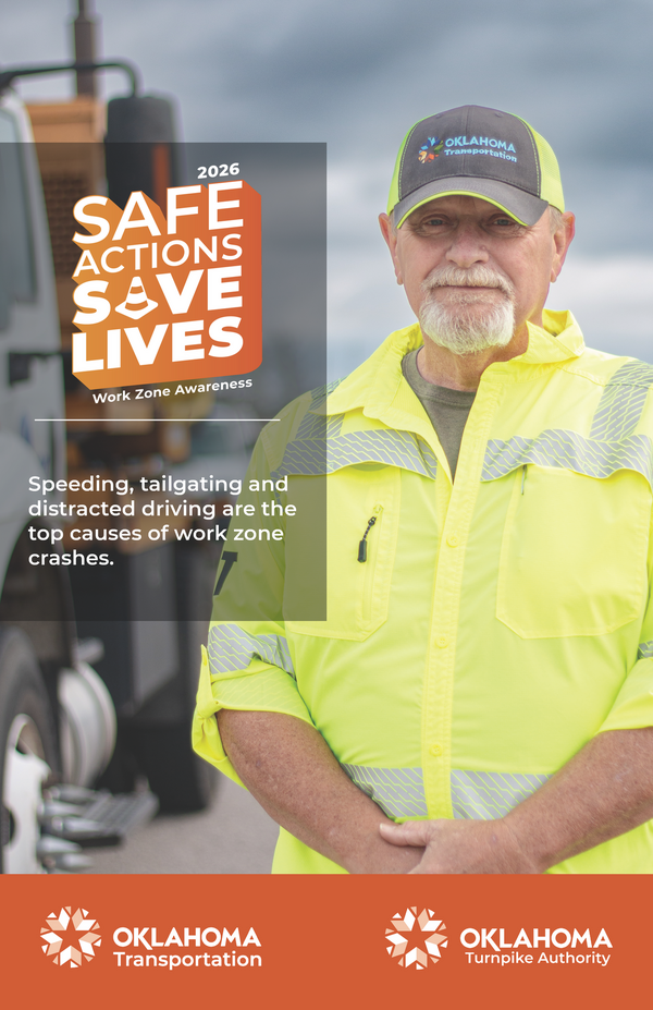 Man in HiVis yellow shirt with road and construction vehicle in background