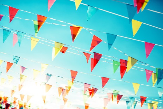 Small colorful flags on a summer day 