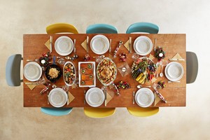 Thanksgiving table with dishes and food