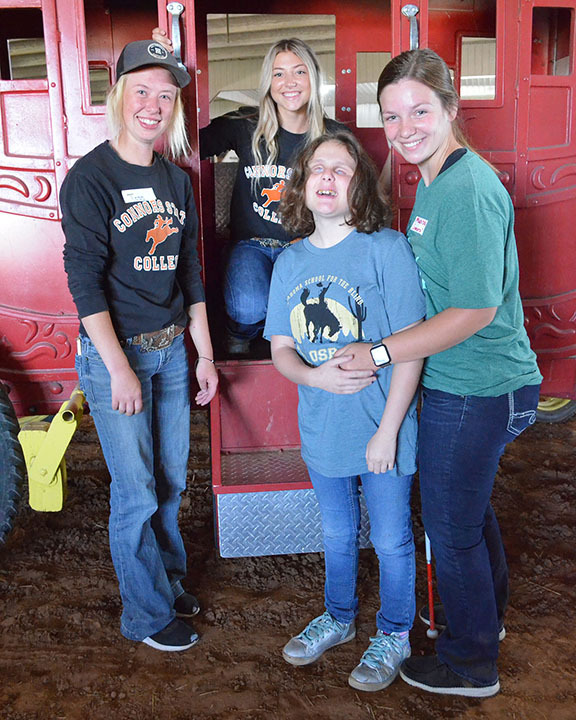 Group in front of stagecoach.