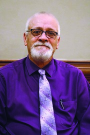 Man wearing glasses and smiling